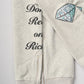 "Don't Rest on Riches" Half-Zip Sweater (Diamond Patches)